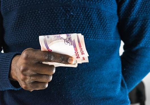 man holding cash