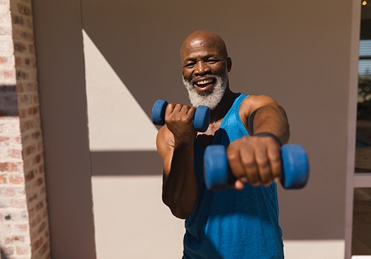 man holding dumbells